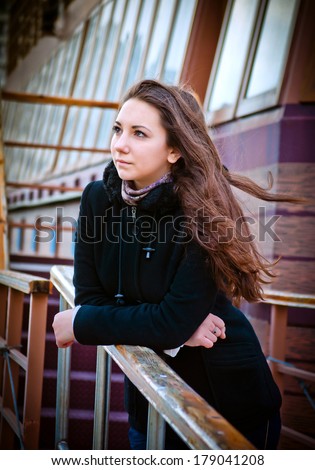 portrait of a pensive young woman looking into the distance