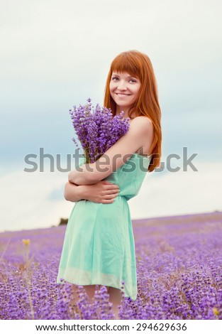 portrait of young beautiful girl in a field