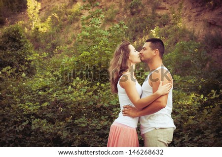 Young attractive couple in love kissing outdoors. Love concept