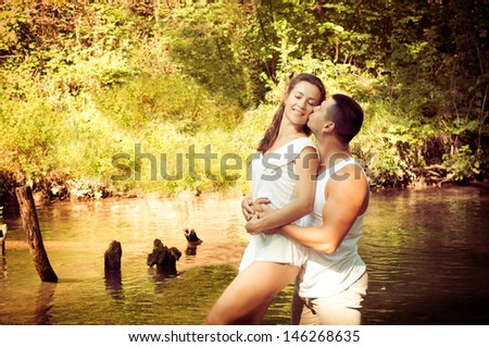 Young attractive couple in love kissing outdoors. Love concept