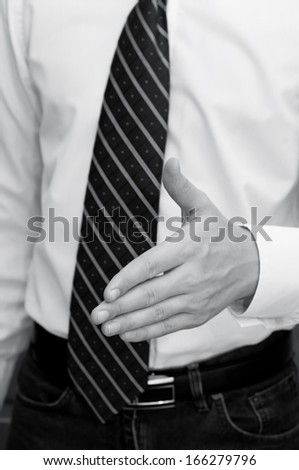 Businessman giving hand for greeting
