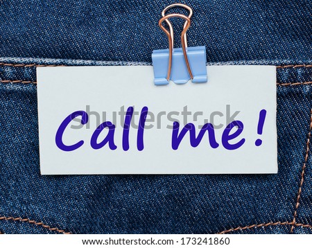 Note with message Call Me written on it on jeans pocket