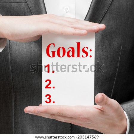 Businessman listing his goals