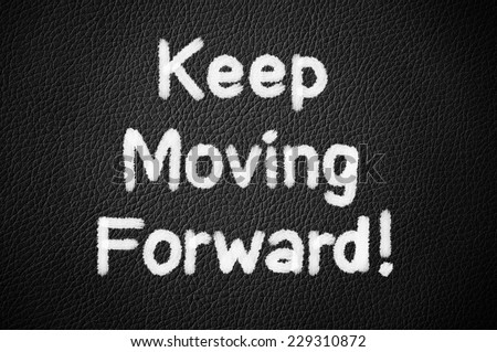 Keep Moving Forward ! written on black leather background