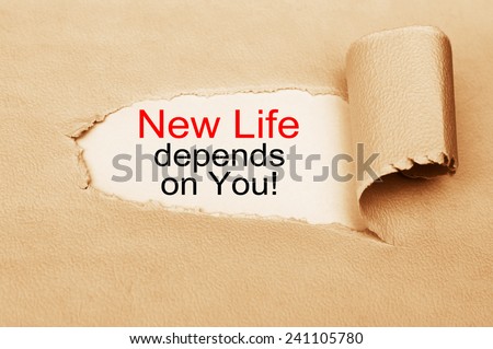 New Life Depends On You! written behind a torn paper