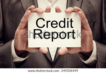 Credit Report in businessman\'s hands
