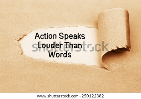 Action Speaks Louder Than Words written behind a torn paper