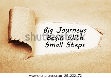 Big Journeys Begin With Small Steps written behind a torn paper