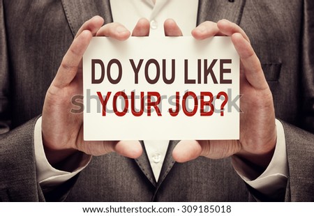 Do You Like Your Job? holding a card with a message text written on it