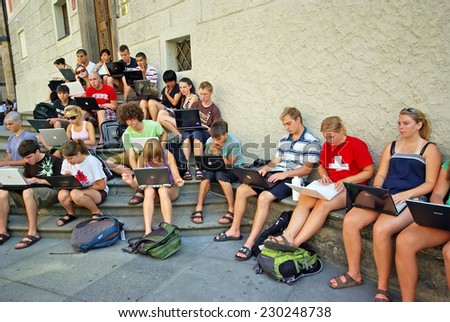 PRAGUE, CZECH REPUBLIC - JULY 31: Young students working on laptop, outdoor lesson on July 31, 2008 in Prague, Czech Republic.