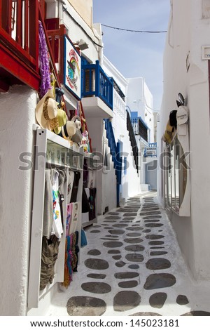 MYKONOS, GREECE- MAY 16: Mykonos street with external colourful stairs of the houses and shops, Mykonos, Greece, on May 16, 2013.