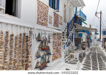 MYKONOS, GREECE- MAY 16: Mykonos street with external colourful stairs of the houses and shops in Mykonos, Greece, on May 16, 2013.