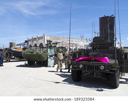 LISBON, PORTUGAL - APRIL 25: Portuguese Military soldiers introduce military tank to people on 25 de Abril celebrations at Commerce Square, Lisbon on April 25, 2014.