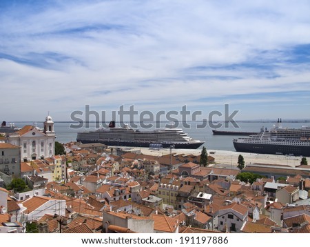LISBON, PORTUGAL - MAY 06: A view of Queen Mary 2, Queen Elizabeth and Queen Victoria Cruise ships from Alfama Miradouro on May 06, 2014 in Lisbon.