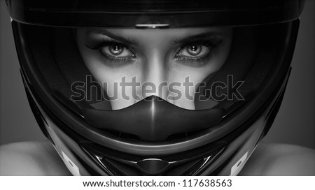black and white photo of sexy woman in helmet on the background