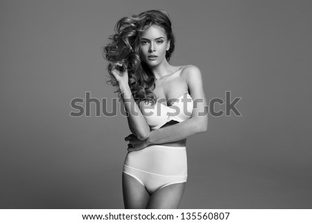 Black and white fashion photo of blonde beauty with natural make