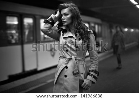 Woman in coat waiting for someone