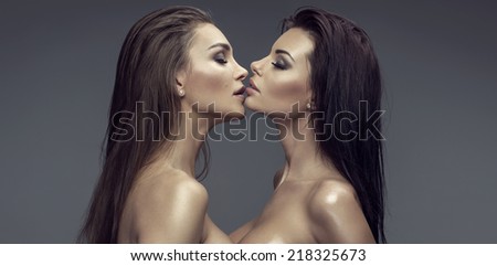 Two beautiful kissing women