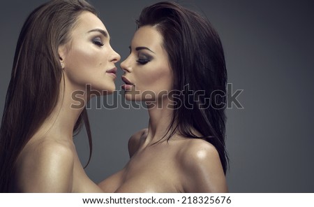 Two sexy women kissing each other