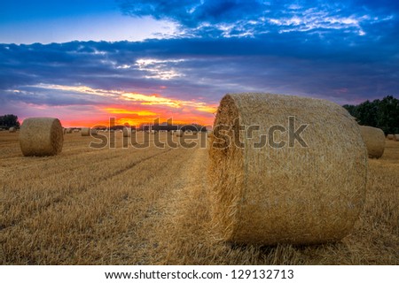 End of day over field with hay bale in Hungary- This photo make HDR