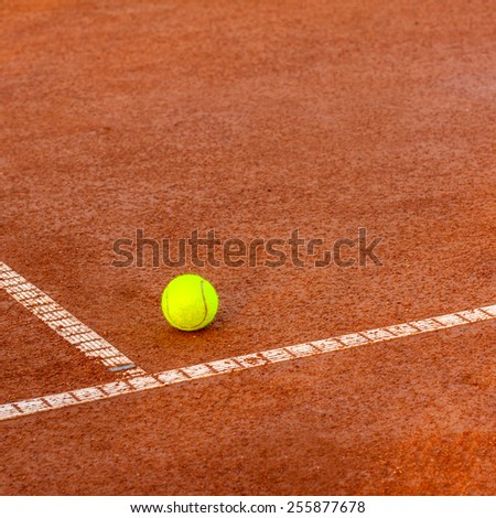 Tennis ball on a tennis clay  court