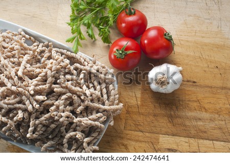 corkscrew shaped raw pasta called busiate with whole wheat flour  of buckwheat typical of Sicily