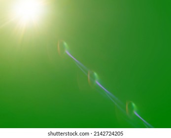 The​ green​ back​ground​ image​ has​ a​ white​ beam​ of​ light​ shining​ through​ it​ for​ Graphics​