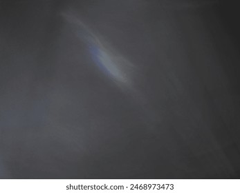 Black​ back​ground​ image​ with​ white​ light​ shining​ through​ used​ for​ Graphics​ work​