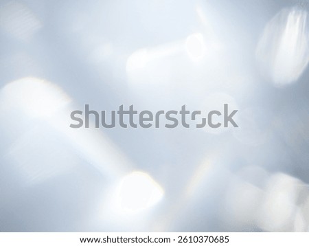 White​ bokeh​ light​ on​ a​ gray​ back​ground​ used​ for​ Graphics​
