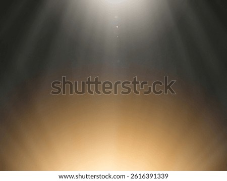 The​ black​ back​ground​ image​ has​ a​ white​ and​ gold​ beam​ of​ light​ shining​ through​ it​ for​ Graphics​