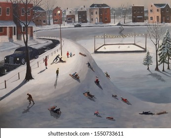 1940s Scene Of Children Tobogganing At A Neighborhood Park On A Snowy Winter Night.  Skating Rink In The Park Is Visible In The Distance.  Nostalgic Scene Of Childhood Memories.