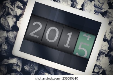 2014 changing to 2015 against tablet pc with blue screen - Shutterstock ID 238080610