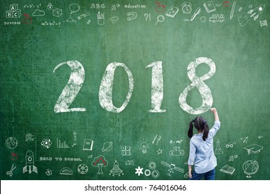 2018 New Calendar Year Greeting By Kid's Hand Drawing On School Teacher's Chalkboard With Student's Educational Doodle For New Academic Year, Education Semester, Class Schedule Concept 