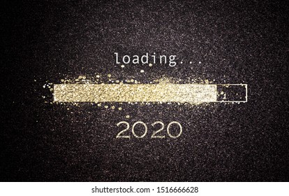 2020 New Year concept with a gold glitter bar loading on a black screen with date as a greeting card design for the holiday season - Powered by Shutterstock