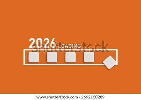 2026 Loading text on Orange backdrop. Ideal for business planning, financial trends, and future economic concepts, close up