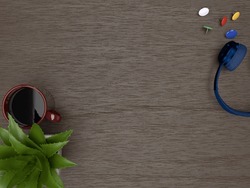 3D Blue Headphone, Aloe Vera Plant, Red Cup Of Coffee And Colorful Flat Thumbtacks On Brown Wooden Table Top View Background.