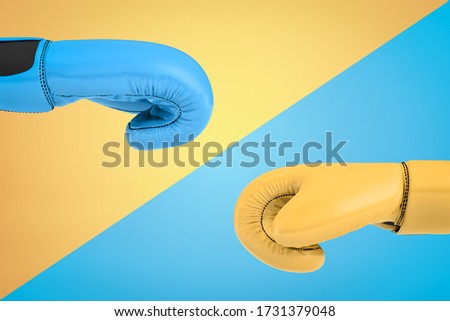 3d close-up rendering of two hands in boxing gloves opposite each other on diagonally split background, blue glove on yellow background, yellow glove on blue one. Sports and hobbies. Rivalry.