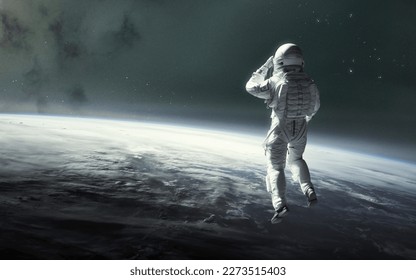 3D illustration of astronaut at Earth orbit. Space walk. 5K realistic science fiction art. Elements of image provided by Nasa - Powered by Shutterstock