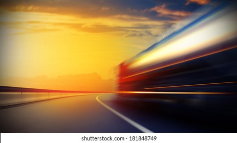 3d illustration of a blurry oil tanker truck on asphalt road under evening sky and sunset light