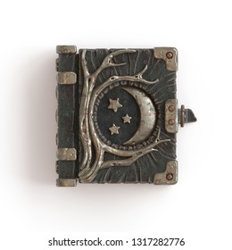 3d Illustration Of A Dark Leather Grimoire. Vintage Old Magic Book Cover With Moon Phases And Tree Roots. Ancient Magic Book Of Shadows. Spellbook Concept. 3d Rendering Isolated On White Background.