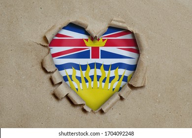 3d illustration. Heart shaped hole torn through paper, showing British Columbia flag