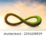 3d illustration of infinity environment concept. infinite earth land with green grass isolated. Eco and circular economy concept. Earth land with green grass isolated on sunset orange sky background.