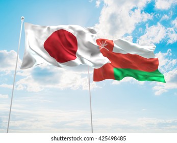 3D illustration of Japan & Oman Flags are waving in the sky