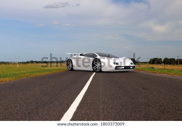 3D illustration. Sports car on a forest road.\
Possible concept of an electric car. Does not exist in reality, not\
a trademark