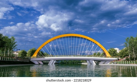 3d Illustration Of Steel Arch Bridge Across Small River In City