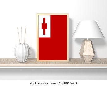 3d Illustration Of Tonga Flag In Photo Frame On Table.