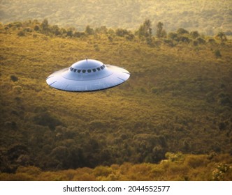 3D illustration of an UFO, unidentified flying object, gravitating over the forest and mountain ranges.