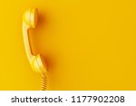 3d illustration. Vintage phone reciever on yellow background. 