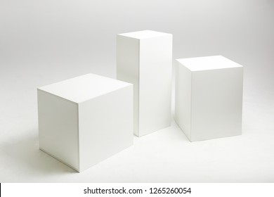 3D Illustration Of White Cubes And Parallelepipeds On Cyclorama In Modern Photo Studio