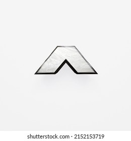 3D Metal Letter, Brushed Metal In The Shape Of The Letter Circumflex.